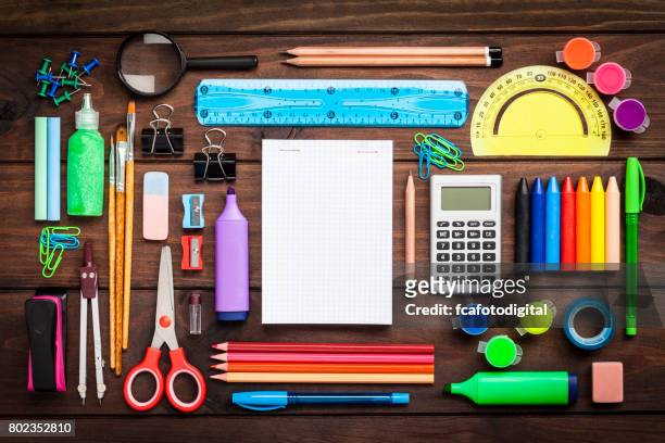 top view of a large group of school or office supplies on wooden table - office equipment stock pictures, royalty-free photos & images