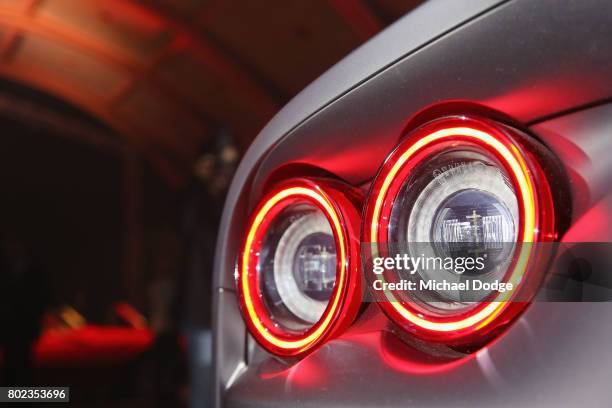 The tail lights of the new Ferrari 812 Superfast is seen at its Australasian Premiere on June 28, 2017 in Melbourne, Australia. The 812 Superfast is...