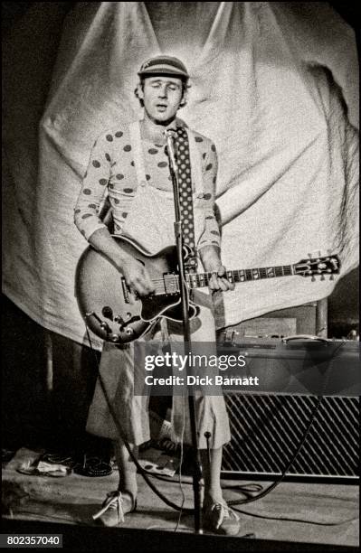 Neil Innes performing on stage, Victoria Palace, London, 1975.