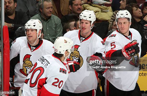 Antoine Vermette of the Ottawa Senators is congratulated for his second period goal against the Montreal Canadiens by teammates Dean McAmmond, Shean...