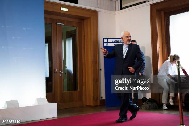 Iranian Minister of Foreign Affairs Mohammad Javad Zarif and German Foreign Minister Sigmar Gabriel arrive to speak to the media following talks on...