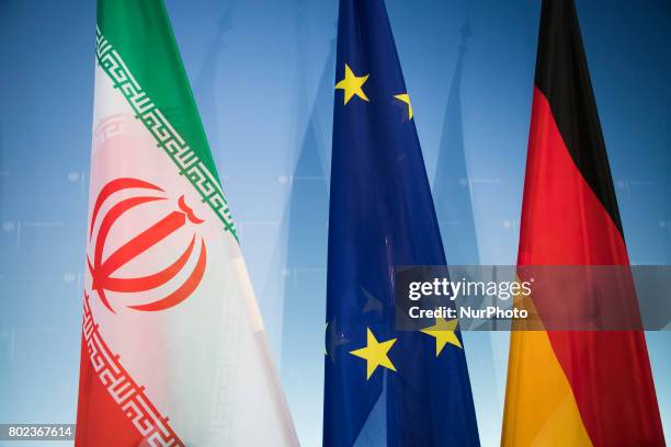 Iran, European and Germany flags are seen during a news conference between the German Vice Chancellor and Foreign Minister Sigmar Gabriel and Iranian...
