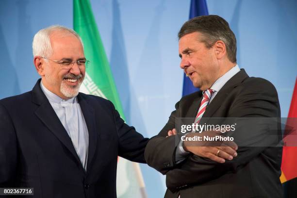German Vice Chancellor and Foreign Minister Sigmar Gabriel and Iranian Foreign Minister Mohammad Javad Zarif shake hands at the end of a news...