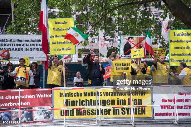 People protest during the meeting between German Vice Chancellor and Foreign Minister Sigmar Gabriel and Iranian Foreign Minister Mohammad Javad...