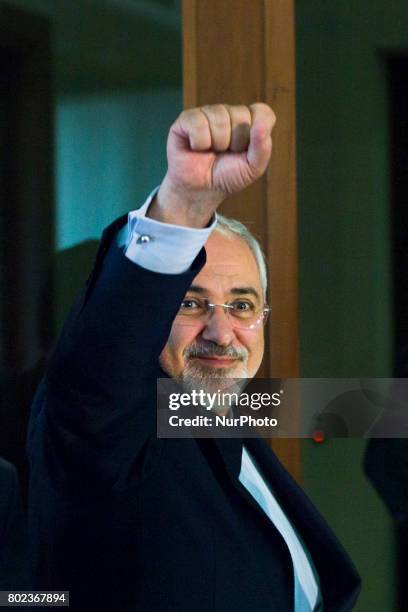 Iranian Foreign Minister Mohammad Javad Zarif greets as he leaves a news conference at the Foreign Ministry in Berlin on June 27, 2017.