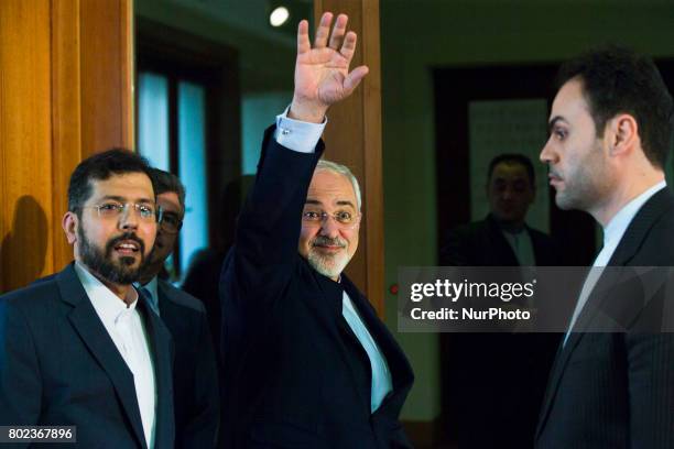 Iranian Foreign Minister Mohammad Javad Zarif greets as he leaves a news conference at the Foreign Ministry in Berlin on June 27, 2017.