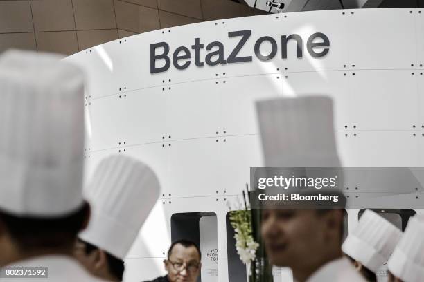 Chefs stand in front of the BetaZone area at the World Economic Forum Annual Meeting of the New Champions in Dalian, China, on Wednesday, June 28,...