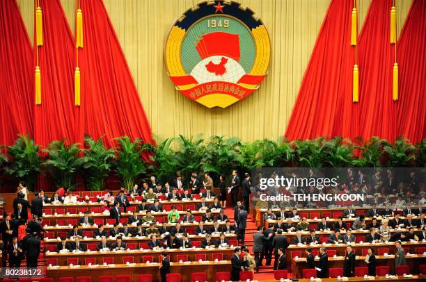 Delegates attend the closing ceremony of the Chinese People's Political Consultative Conference at the Great Hall of the People in Beijing on March...