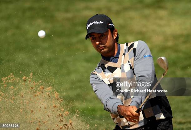 Jyoti Randhawa of India plays from a greenside bunker on the 16th during round two of the Ballantine's Championship at Pinx Golf Club on March 14,...
