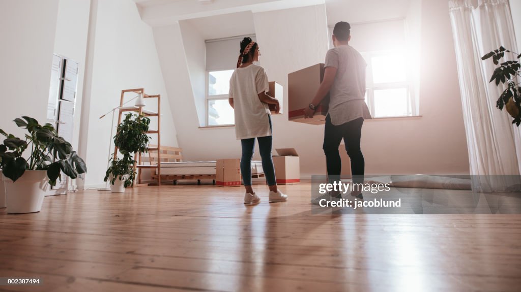 Young couple moving in new house