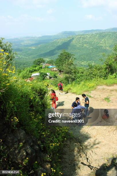 trekking in nature surrounded with green hills - bangalore tourist stock pictures, royalty-free photos & images