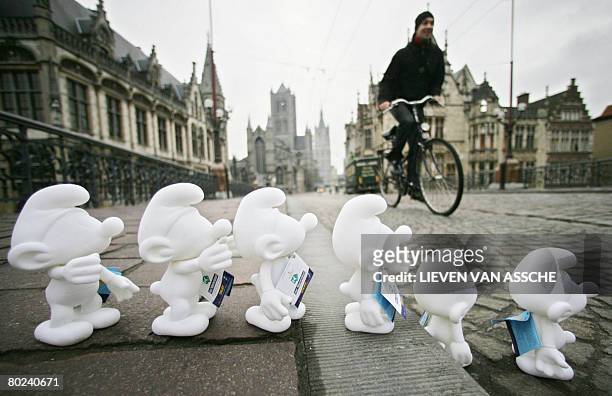 White cartoon characters Smurfs stand on March 14, 2008 in a street of Gent to celebrate the 50th anniversary of Peyo's Smurfs. People can take a...