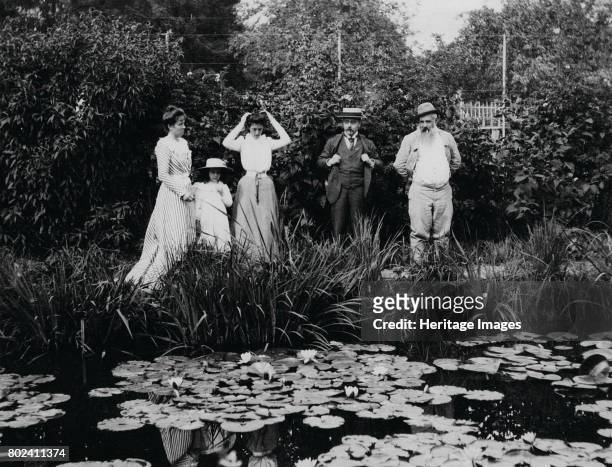 Germaine HoschedÈ, Lili Butler, Mme Joseph Durand-Ruel, Georges Durand-Ruel and Claude Monet at the water lily pond in Giverny, 1900. Found in the...