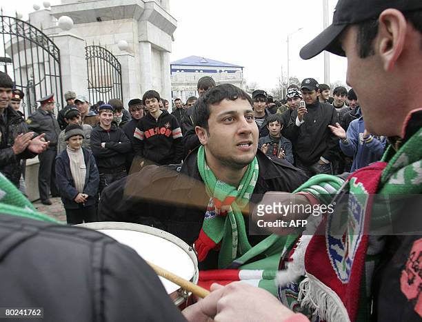 Chechen football fans wait outside the stadium for the start of the first football league match in 14 years on March 14, 2008 in Grozny. The match...