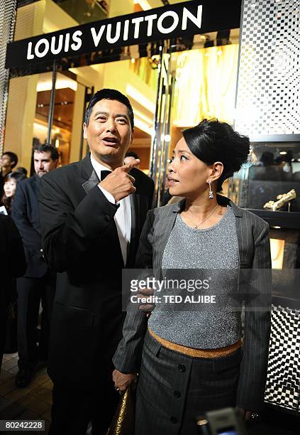 Hong Kong actor Chow Yun Fat and his wife Jasmine arrive for the re-opening of a Louis Vuitton shop in Hong kong on March 14, 2008. Louis Vuitton...