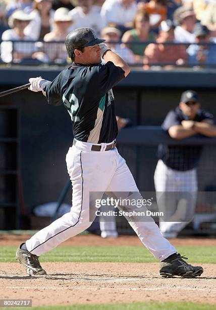 Rob Johnson of the Seattle Mariners swings at the pitch against the San Diego Padres on March 2, 2008 at Peoria Sports Complex in Peoria, Arizona....