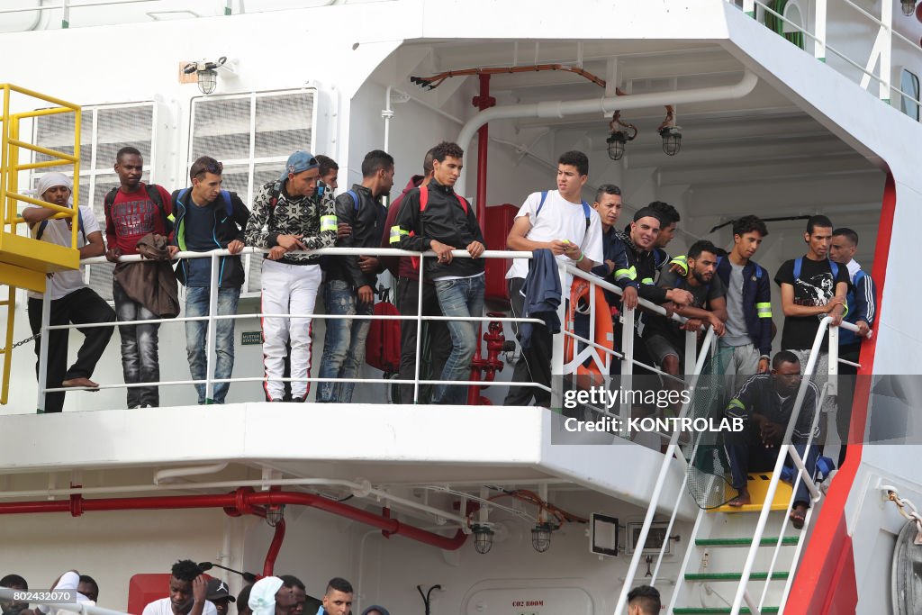 Some migrants during the landing by ship Vos Prudence in...