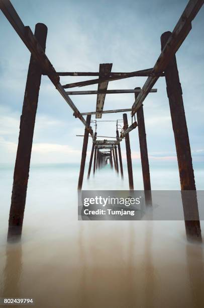 wooden bridge on beautiful sunset in phang nga province thailand. - boat ruins stock pictures, royalty-free photos & images