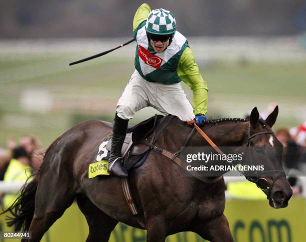 Jockey Sam Thomas rides Denman up the final straight to victory in The Totesport Cheltenham Gold Cup steeple chase race during the fourth day of the...