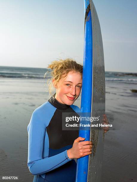 portrait of a female surfer. - croyde beach stock pictures, royalty-free photos & images