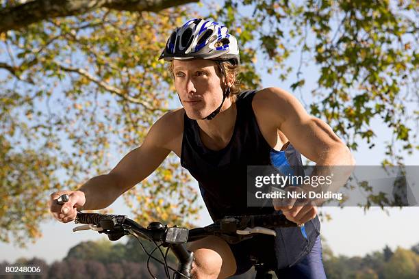 cyclist riding mountain bike. - bike winning imagens e fotografias de stock