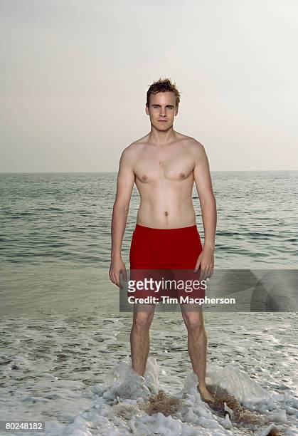 man wearing a swimming costume. - men swimwear stock pictures, royalty-free photos & images