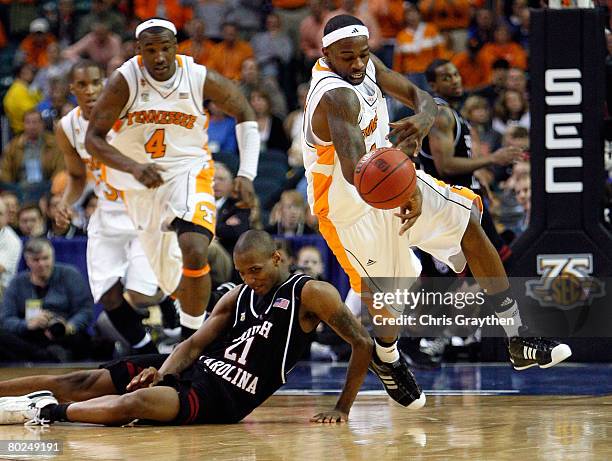 Tyler Smith of The Univeristy of Tennessee Volunteers steals the ball from Dominique Archie of the South Carolina Gamecocks during the SEC Men's...