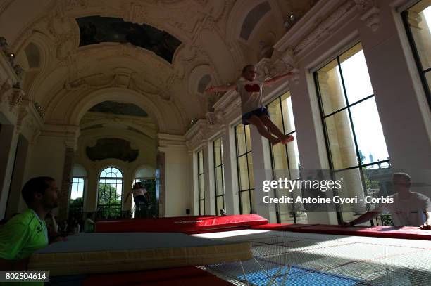 Young person performs on a trampoline at the Petit Palais as Paris promotes its candidacy for the 2024 Summer Olympic and Paralympic Games on June...