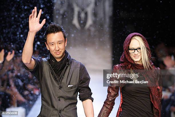 Fashion designer Eric Kim and a model appear at the Monarchy show during L.A. Fashion Week Fall 2008 on March 13, 2008 at Smashbox Studios in Los...