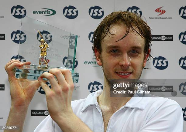 James Willstrop of England celebrates with his trophy after winning against Cameron Pilley of Australia during the final of the ISS Canary Wharf...