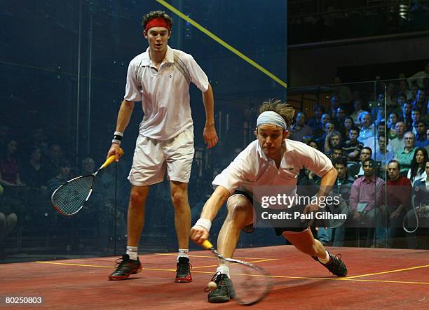 James Willstrop of England in action against Cameron Pilley of Australia during the final of the ISS Canary Wharf Squash Classic at East Winter...