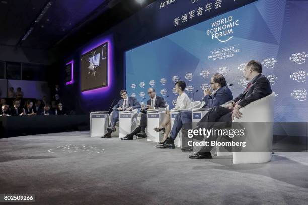 Nicholas Davis, head of Society & Innovation at the World Economic Forum, from left, Tharman Shanmugaratnam, Singapore's deputy prime minister, Jean...