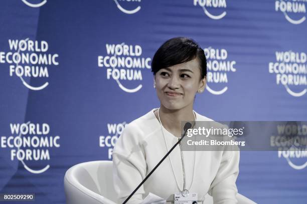 Jean Liu, president of Didi Chuxing, listens during a session at the World Economic Forum Annual Meeting of the New Champions in Dalian, China, on...