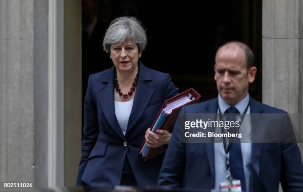 Theresa May, U.K. Prime minister, leaves number 10 Downing Street on her way to attend the weekly question and answer session in Parliament in...