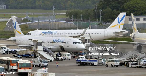 File photo taken in May 2014 shows aircraft of Japanese budget airline Vanilla Air at Narita airport, near Tokyo. The airline, wholly owned by ANA...