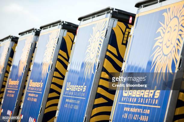 Line of heavy goods trucks stand parked outside the Waberer's International Zrt. Headquarters in Budapest, Hungary, on Tuesday, June 27, 2017....