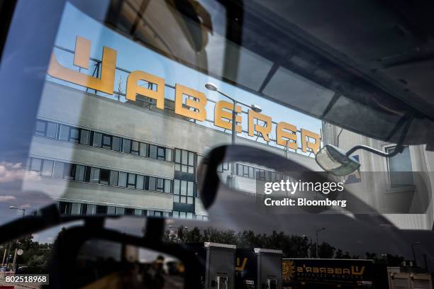 Waberers sign stands on top of the the Waberer's International Zrt. Headquarters office building in Budapest, Hungary, on Tuesday, June 27, 2017....