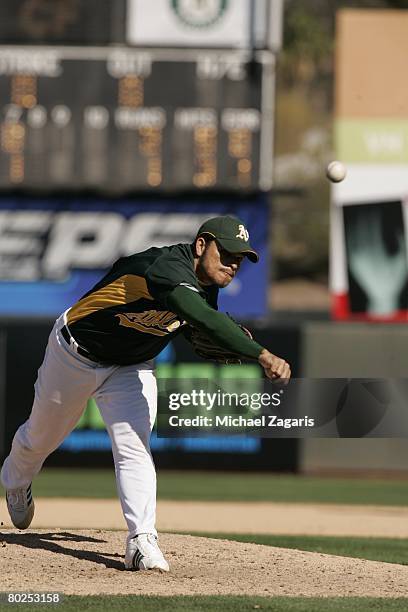 Henry Rodriguez of the Oakland Athletics pitches during the MLB game against the Colorado Rockies at Phoenix Municipal Stadium on March 2, 2008 in...