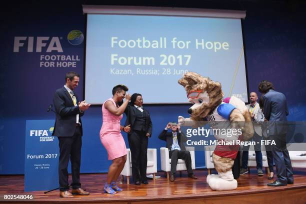 Karina Leblanc dances with 2018 FIFA World Cup mascot Zabivaka during the Football For Hope Forum on June 28, 2017 in Kazan, Russia.