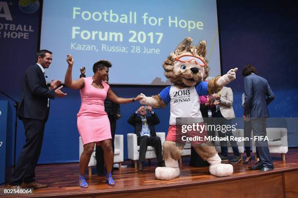 Karina Leblanc dances with 2018 FIFA World Cup mascot Zabivaka during the Football For Hope Forum on June 28, 2017 in Kazan, Russia.