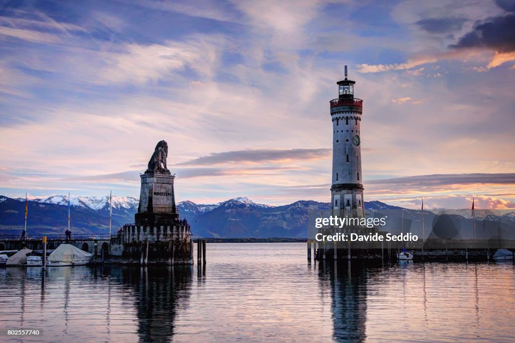 The Bavarian lion monument and a lighthouse a the entrance of the seaport of Lindau