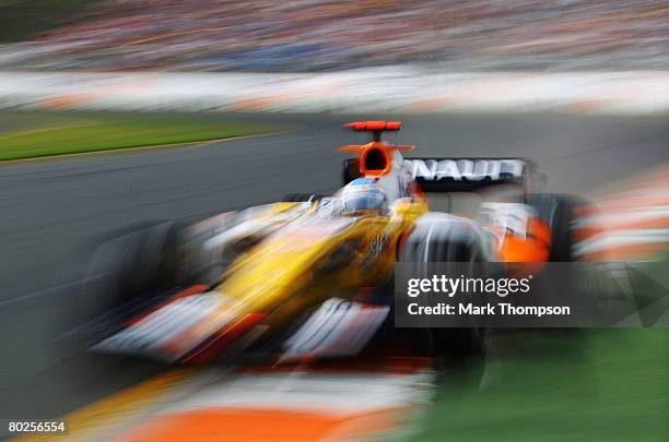 Fernando Alonso of Spain and Renault drives during the warm up session prior to qualifying for the Australian Formula One Grand Prix at the Albert...