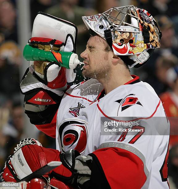 John Grahame of the Carolina Hurricanes cools off during a break against the Buffalo Sabres on March 14, 2008 at HSBC Arena in Buffalo, New York.