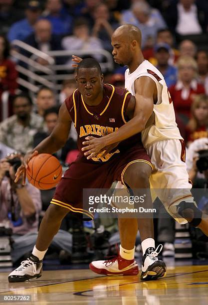 Eric Boateng of the Arizona State Sun Devils dribbles against the defense of Taj Gibson of the USC Trojans during the 2008 Pacific Life Pac-10 Men's...