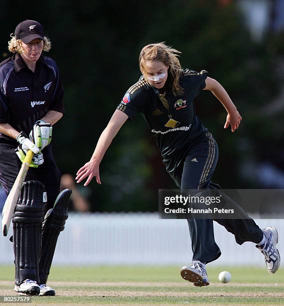 Ellyse Perry of Australia fields off her own bowling during the fourth Rose Bowl Series One Day International match between the New Zealand Silver...