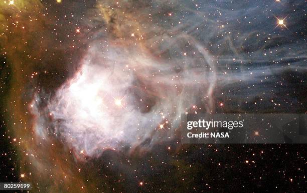 Is the designation for a region of ionized hydrogen gas surrounding an association of young stars in the Large Magellanic Cloud , a nearby, small...