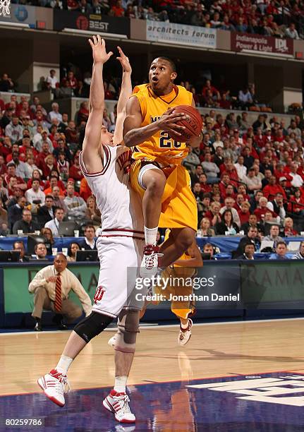 Lawrence Westbrook of the Minnesota Golden Gophers drives for a shot attempt against Kyle Taber of the Indiana Hoosiers during the Big Ten Men's...