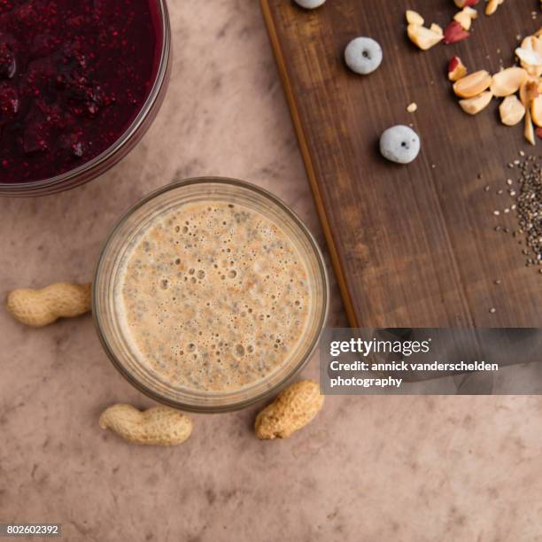 preparing chia pudding with blueberry compote. - texture mousse stock pictures, royalty-free photos & images