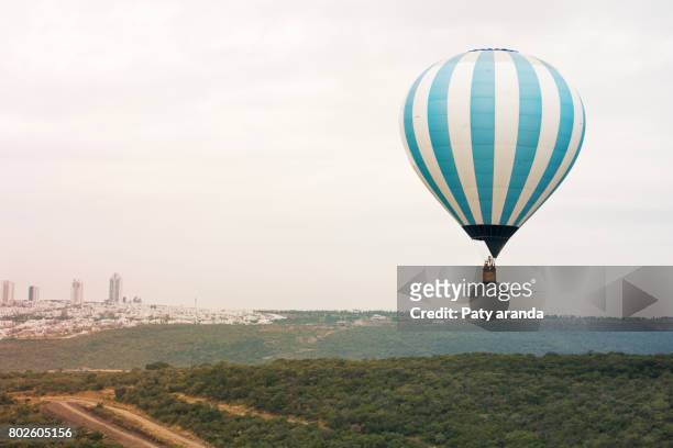 a hot air ballon color blue - león mexico bildbanksfoton och bilder