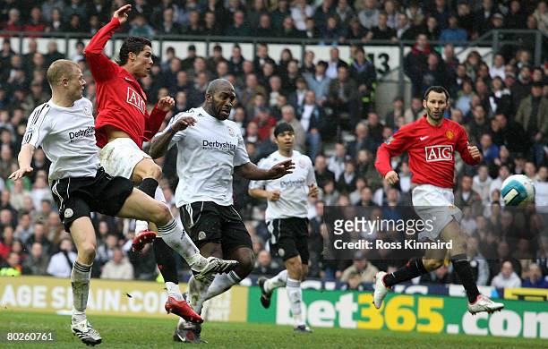 Cristiano Ronaldo of Manchester scores the opening goal during the Barclays Premier League match between Derby County and Manchester United at Pride...